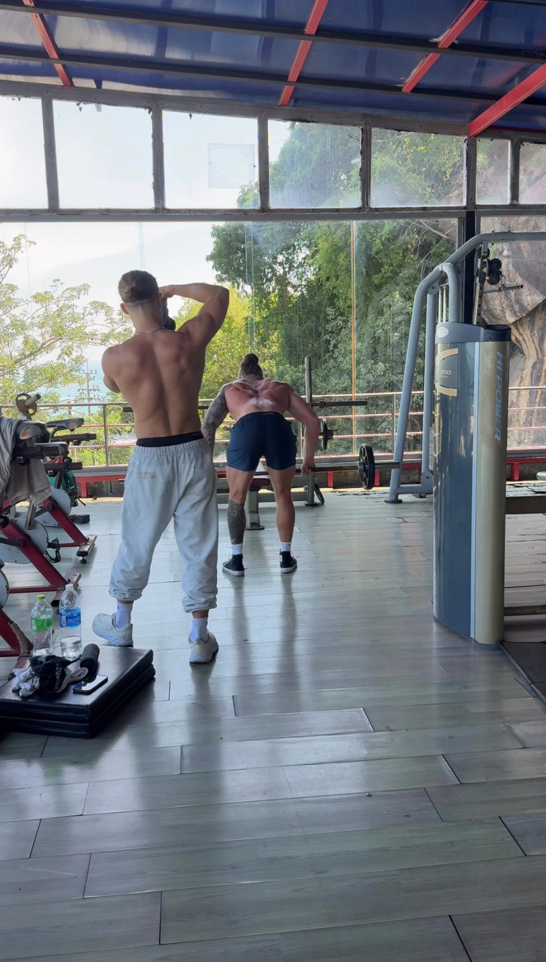 Timon and Jack filming content in the gym