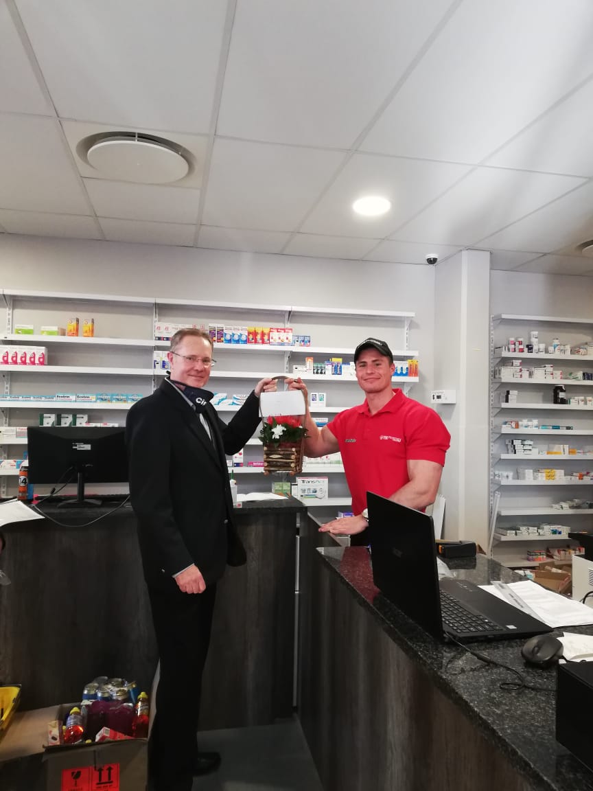 Timon at his pharmacy job in South Africa